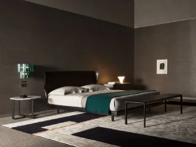 Double bed in leather with a blue headboard by Molteni & C.