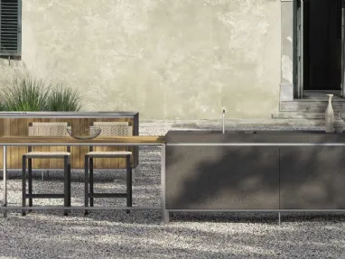 Outdoor design kitchen with double Helios island in volcano ceramic and teak by Molteni & C