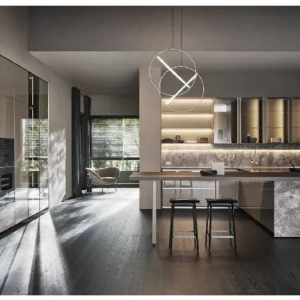 Design kitchen with Prime peninsula in glossy lacquered Clay and Molteni & C Stone.